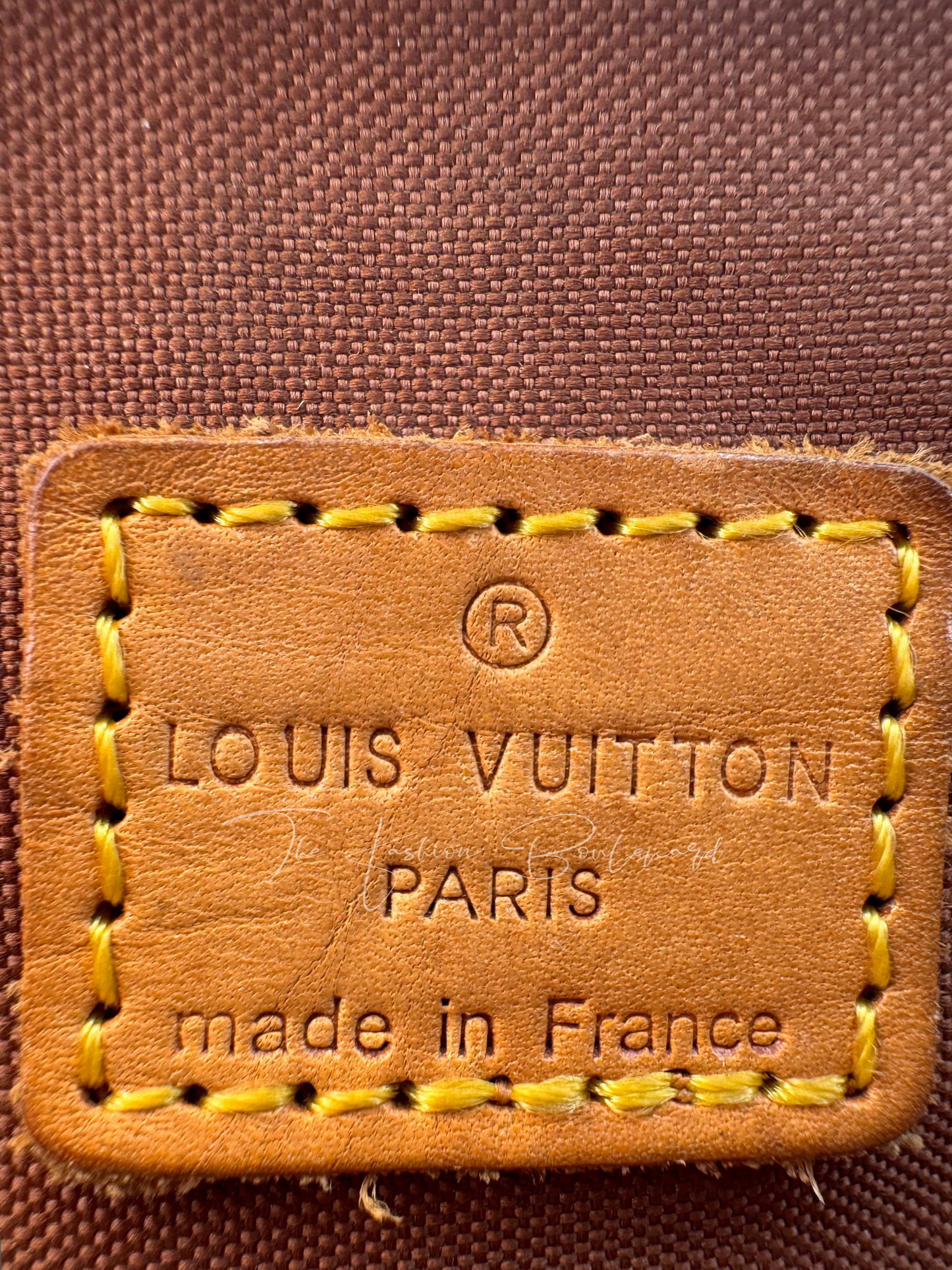Louis Vuitton Tivoli PM Handbag in Monogram Canvas & Natural Cowhide Leather Trim